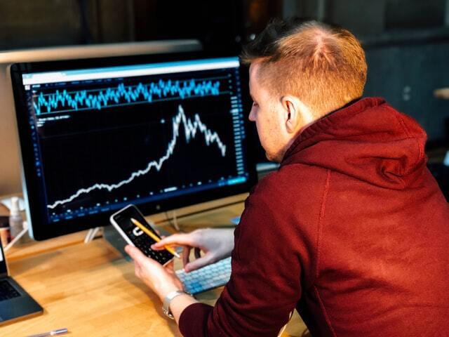 Man watching data chart on the computer.